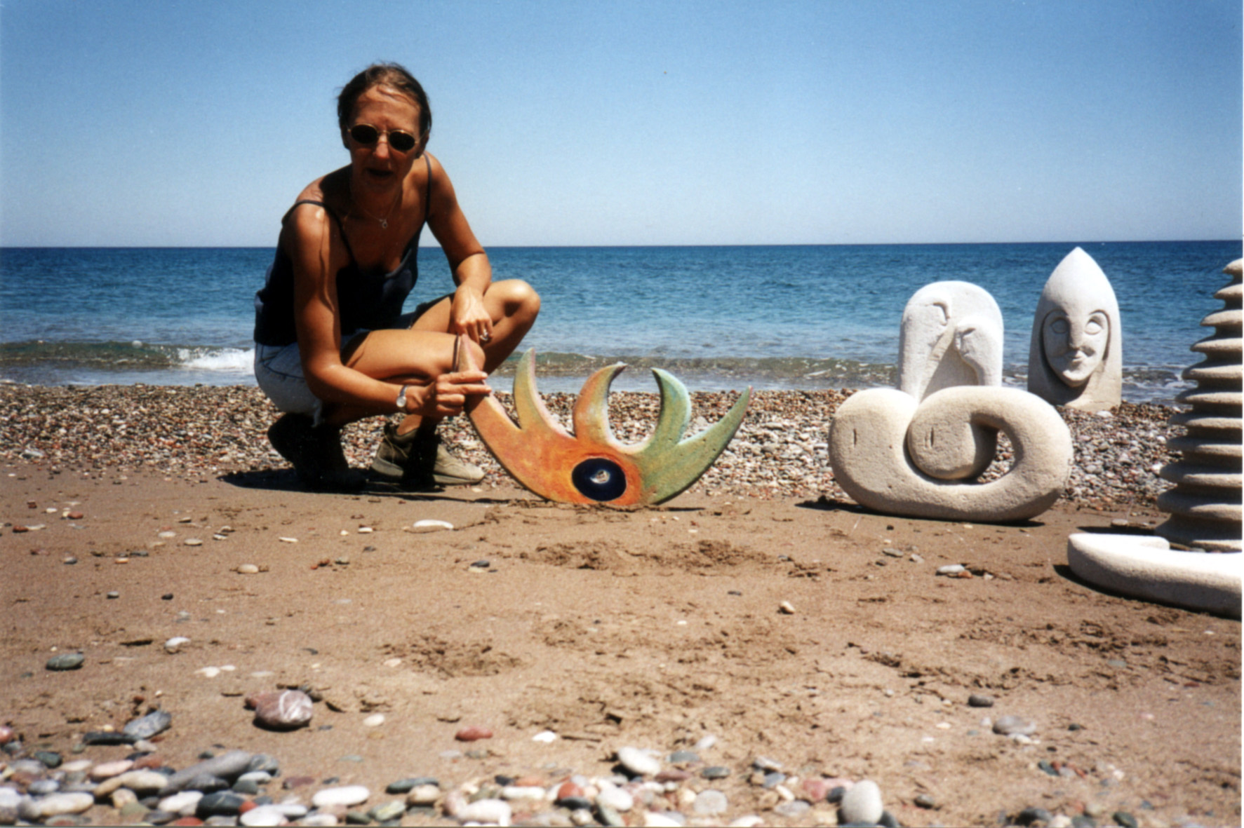 Inez with artwork at the beach